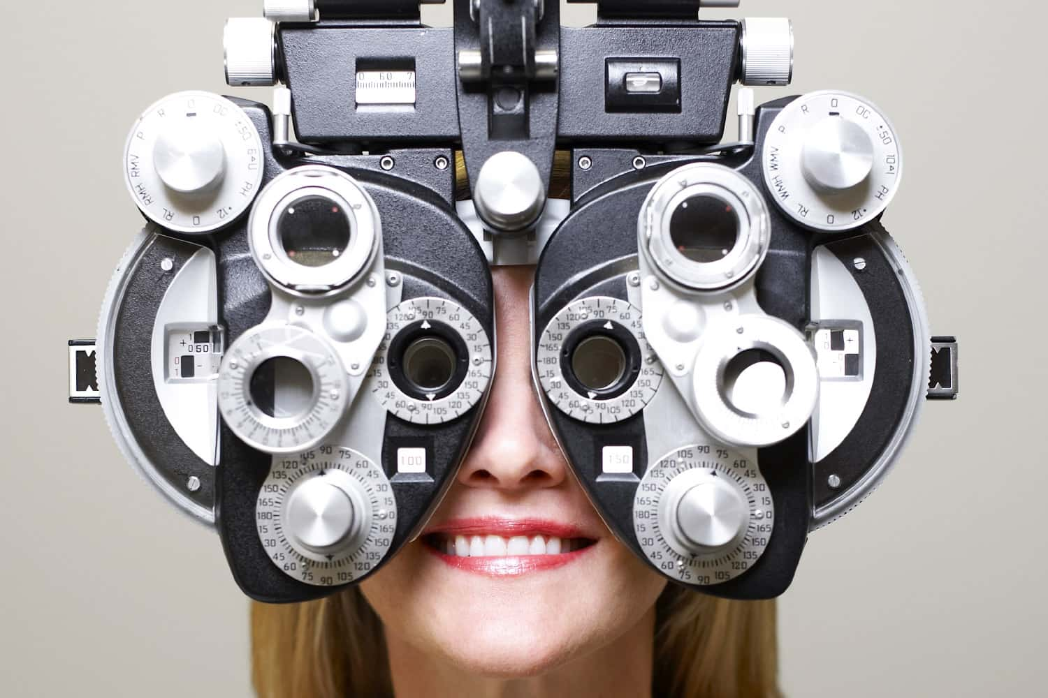 An optician looking through a headset.